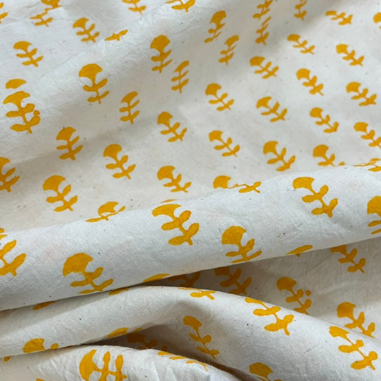 White fabric with yellow floral patterns