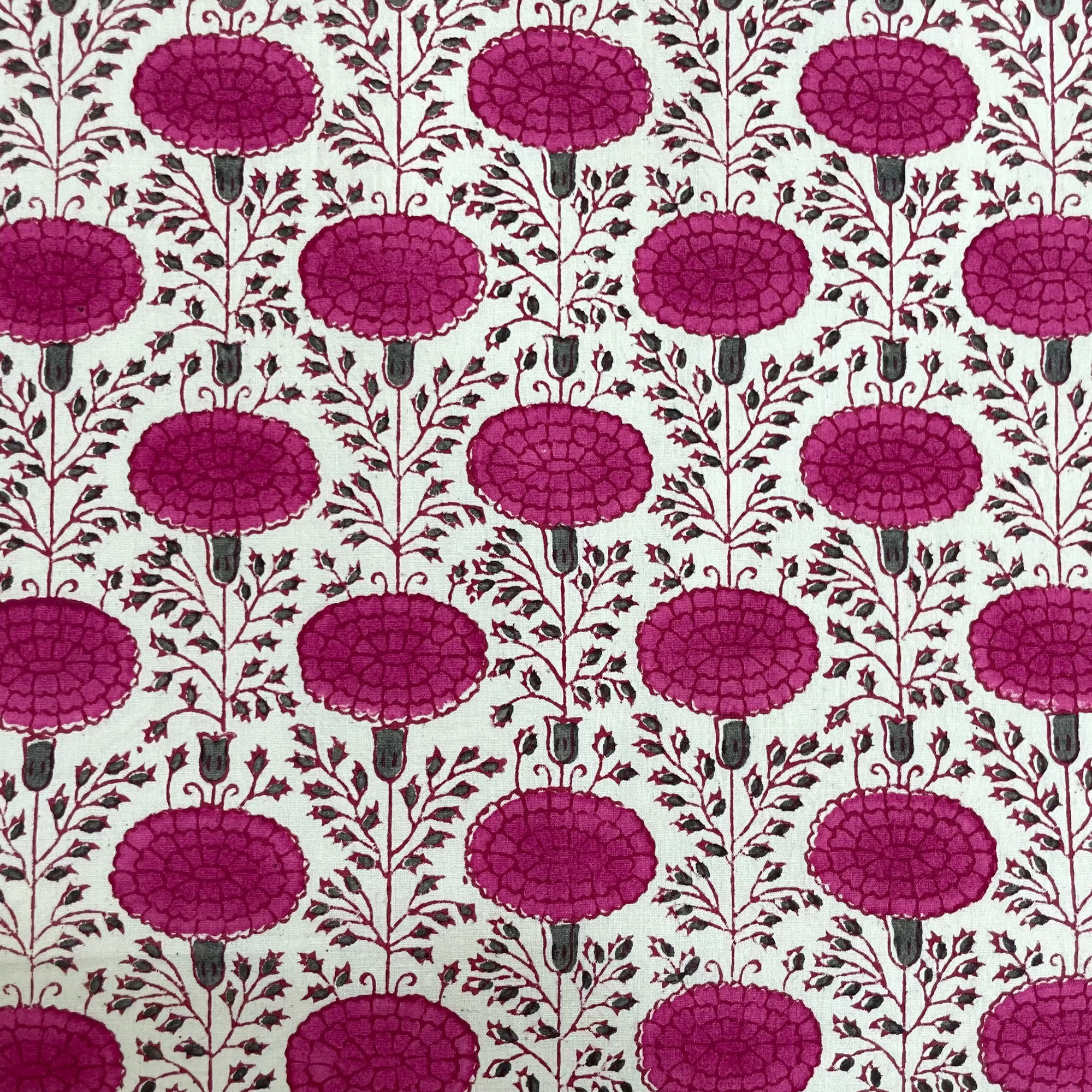 Patterned fabric with plum floral design on a white background