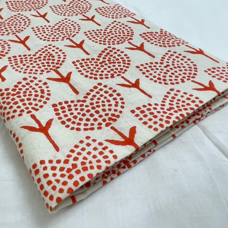 Fabric with red tree pattern on a white background