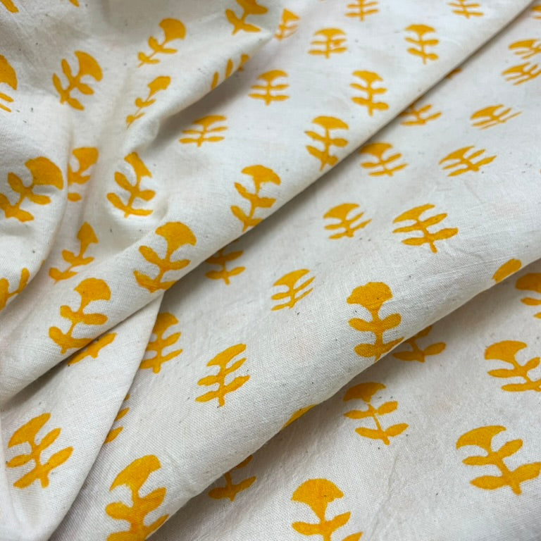 White fabric with yellow floral patterns
