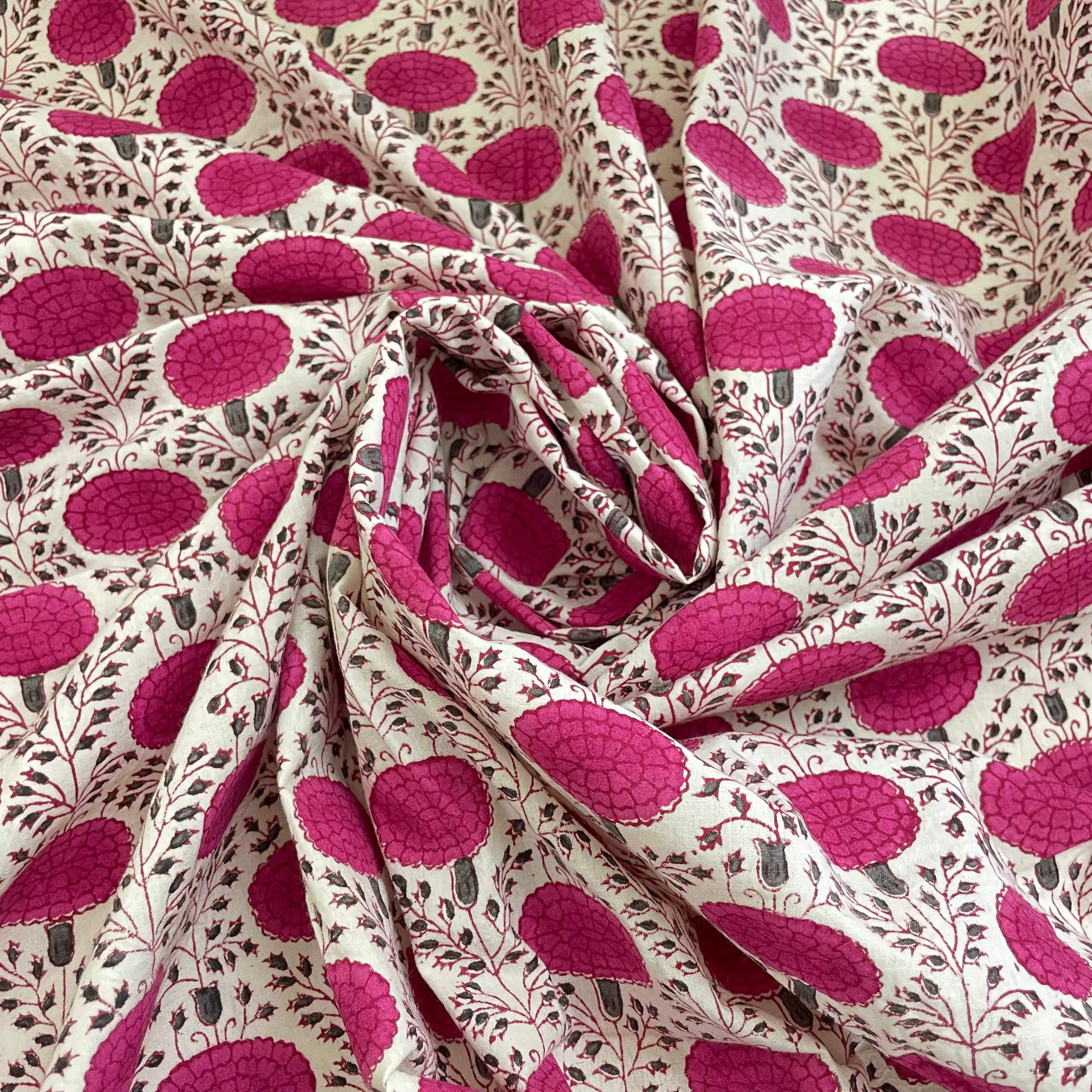 Fabric with pink leaf pattern on a beige background