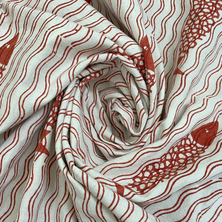 Fabric with red fish pattern on a white background