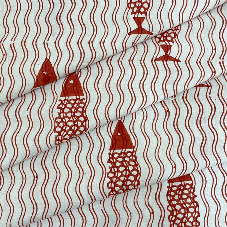 Fabric with red fish pattern on a white background