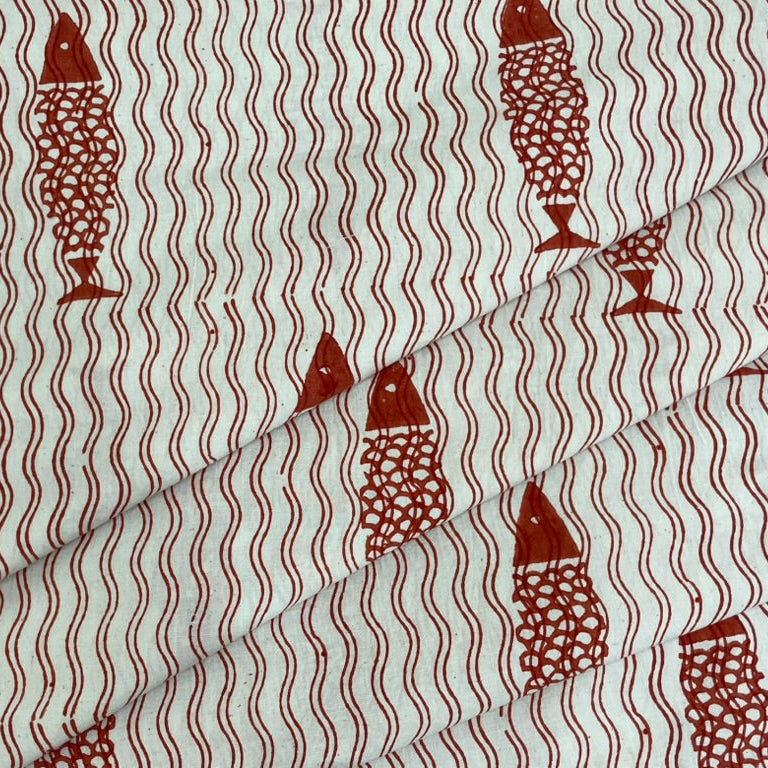 Fabric with brown fish pattern on a white background