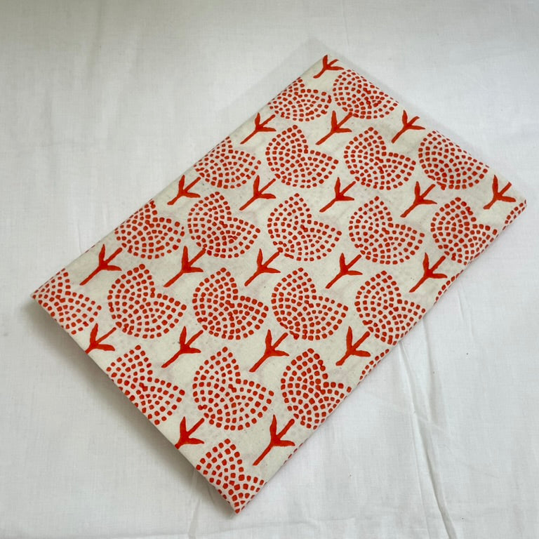 Fabric with red floral pattern on a white background