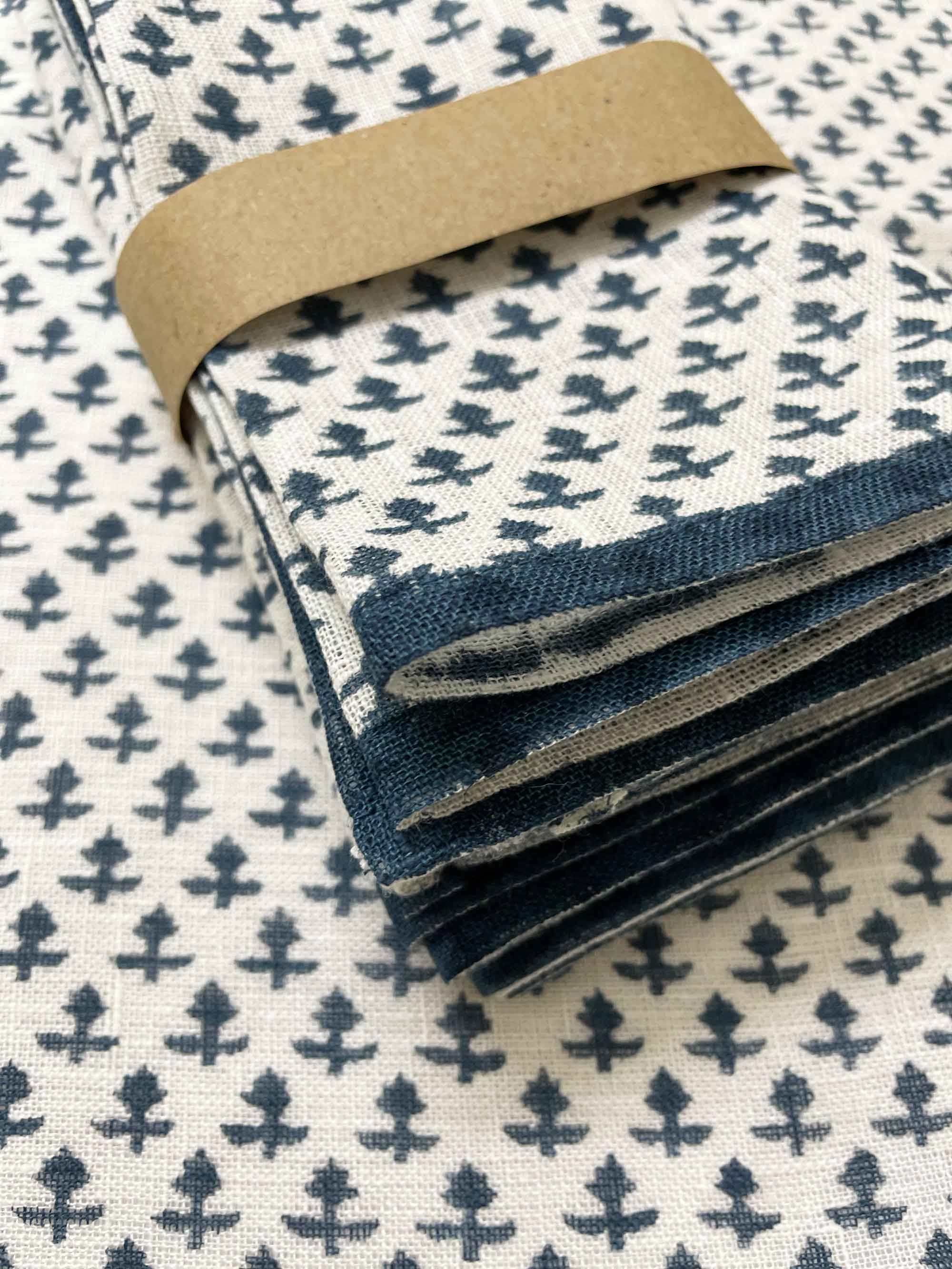 sustainable pure linen napkins in cobalt blue print, eco-conscious dinner table décor.