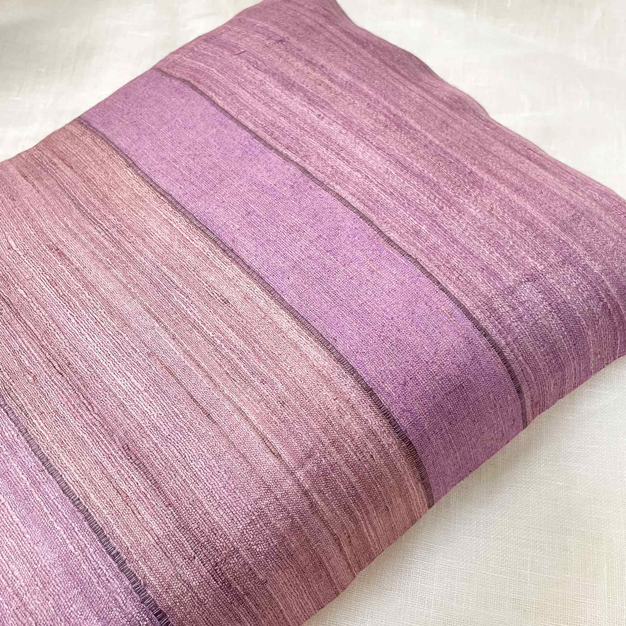 Purple textured pillow on a white background