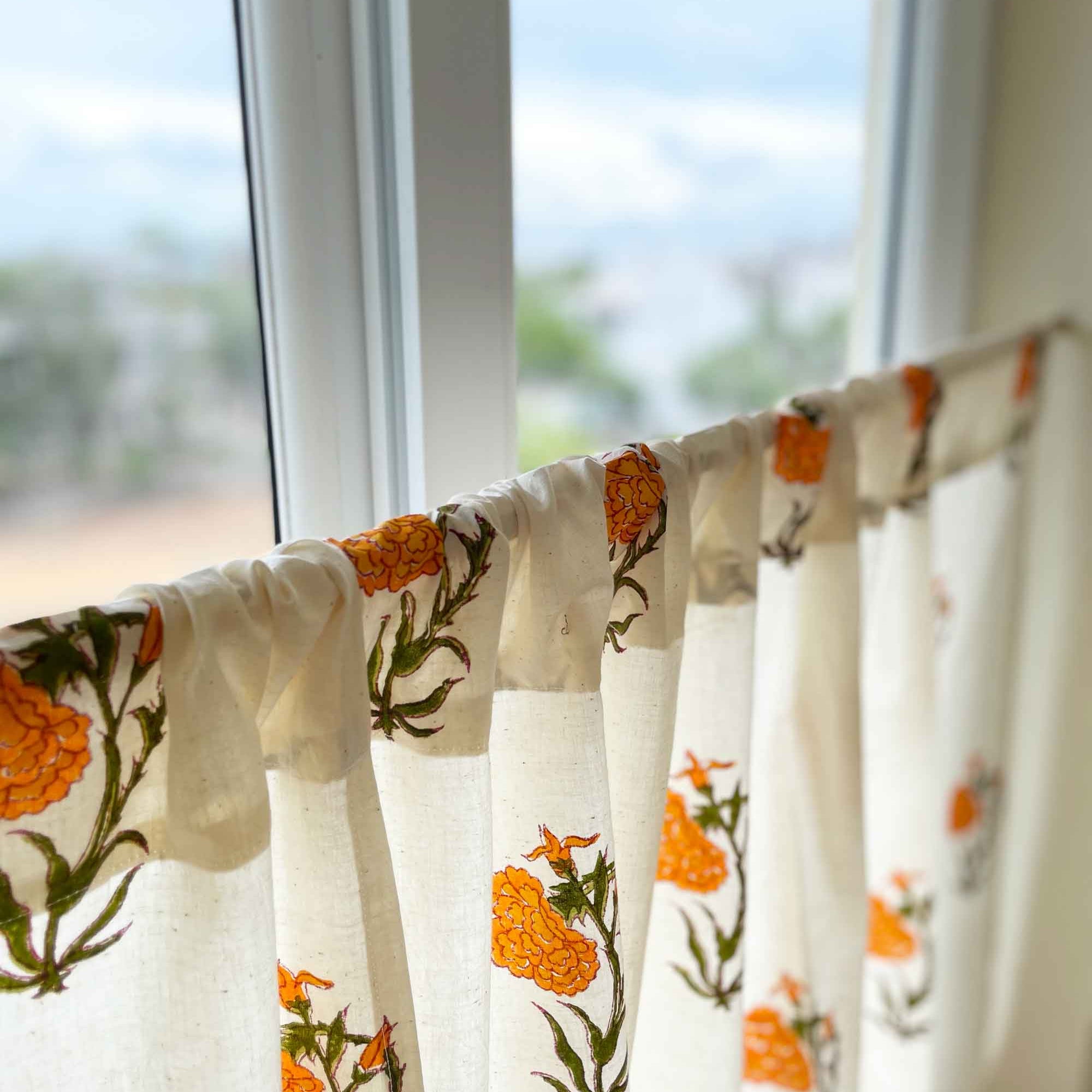 Orange marigold hand block printed café curtain in cotton, rod pocket style for kitchen or pantry.