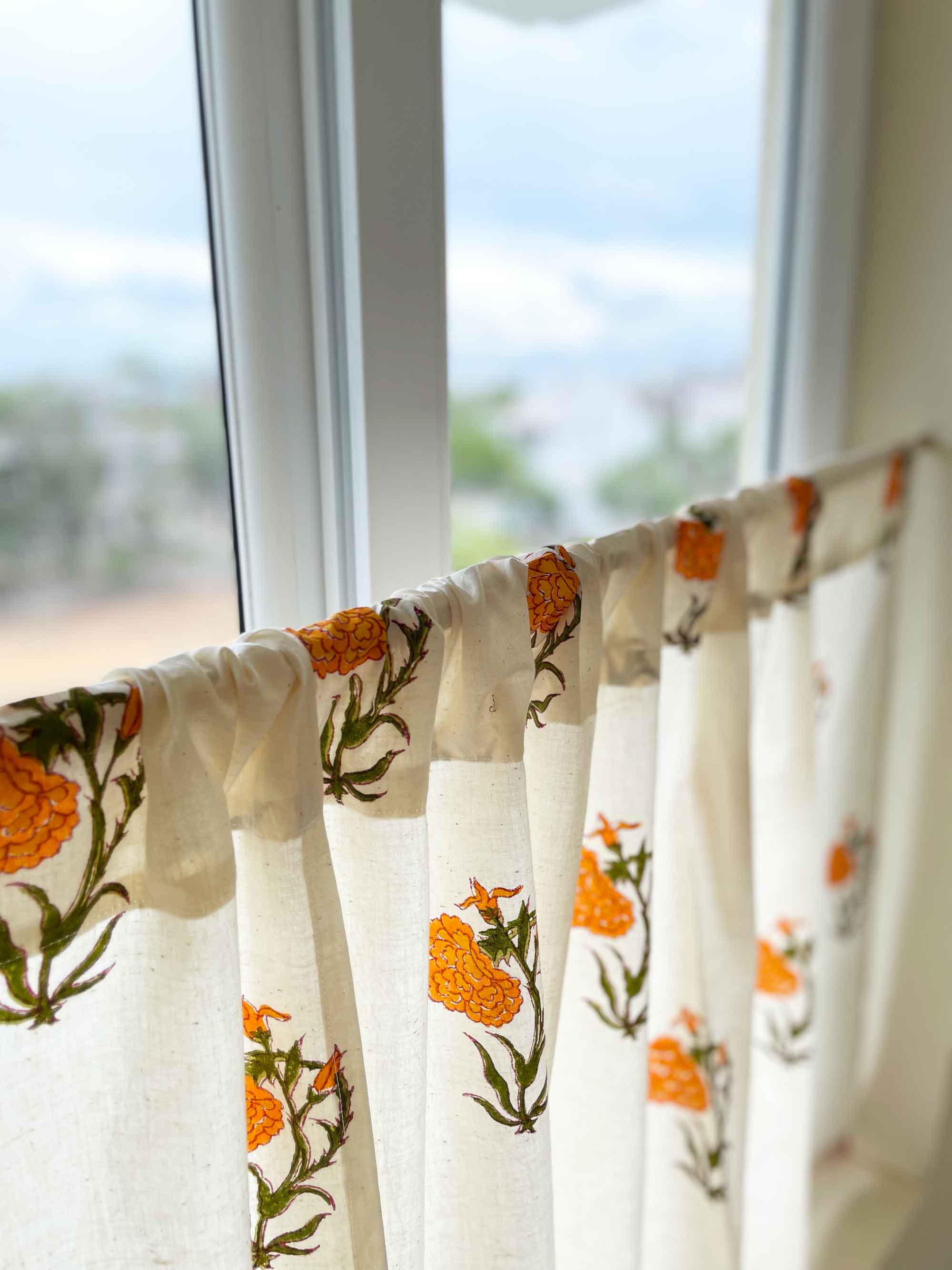 Orange marigold hand block printed café curtain in cotton, rod pocket style for kitchen or pantry.