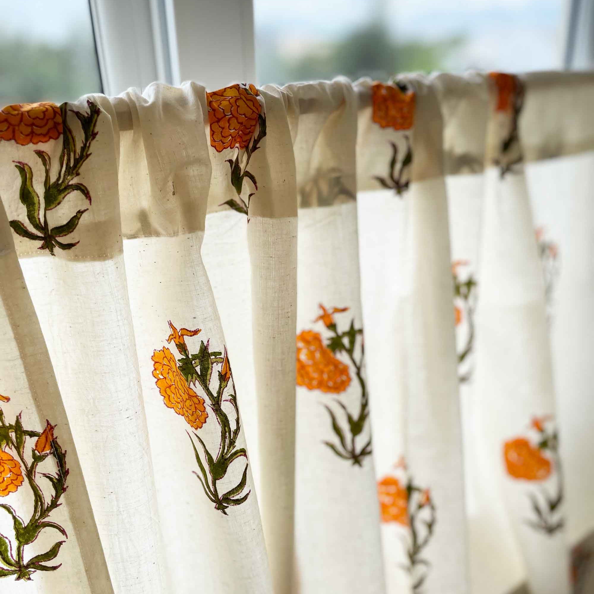 Handcrafted orange marigold block print café curtain for rustic and modern kitchen spaces.