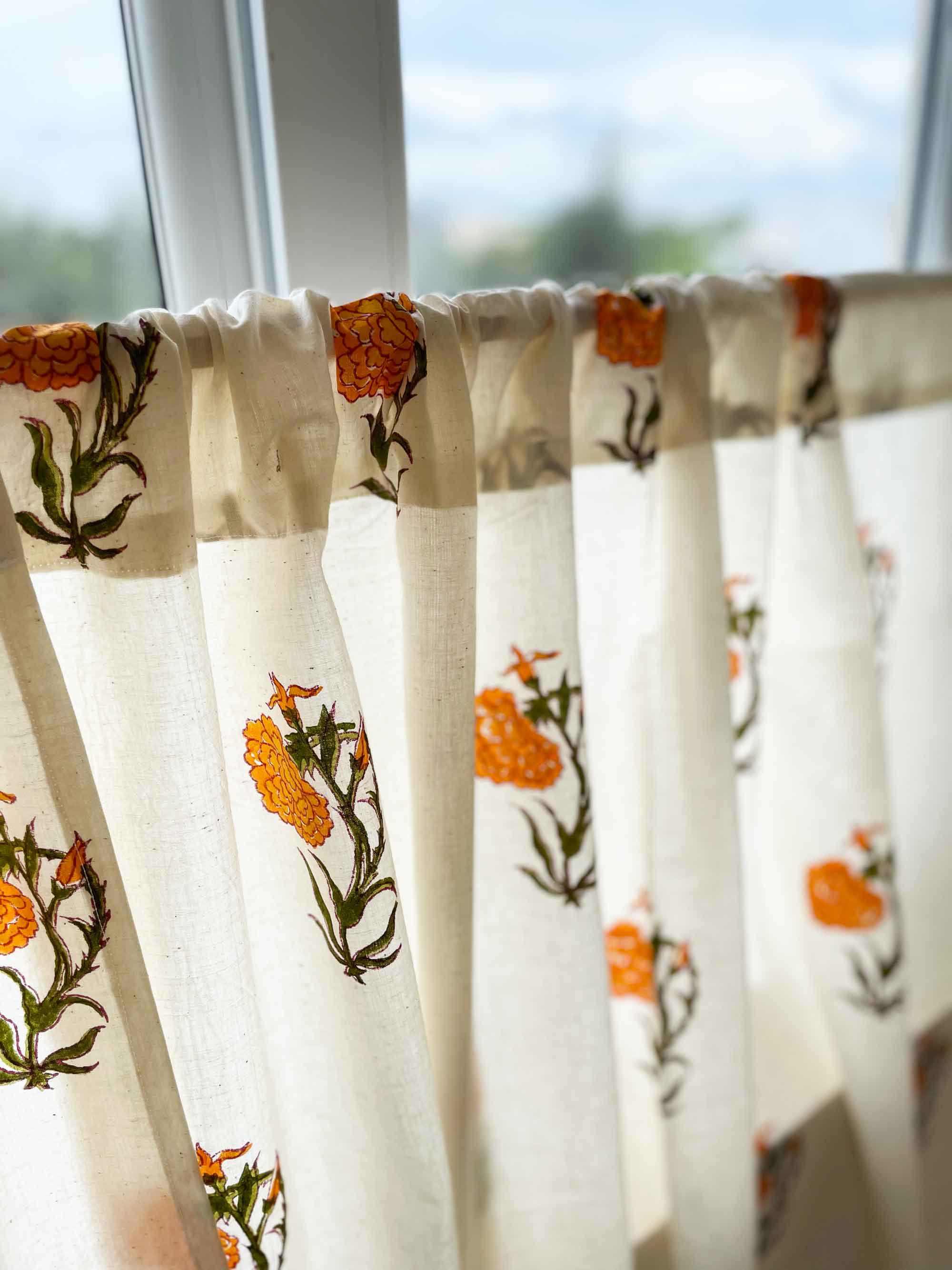 Handcrafted orange marigold block print café curtain for rustic and modern kitchen spaces.