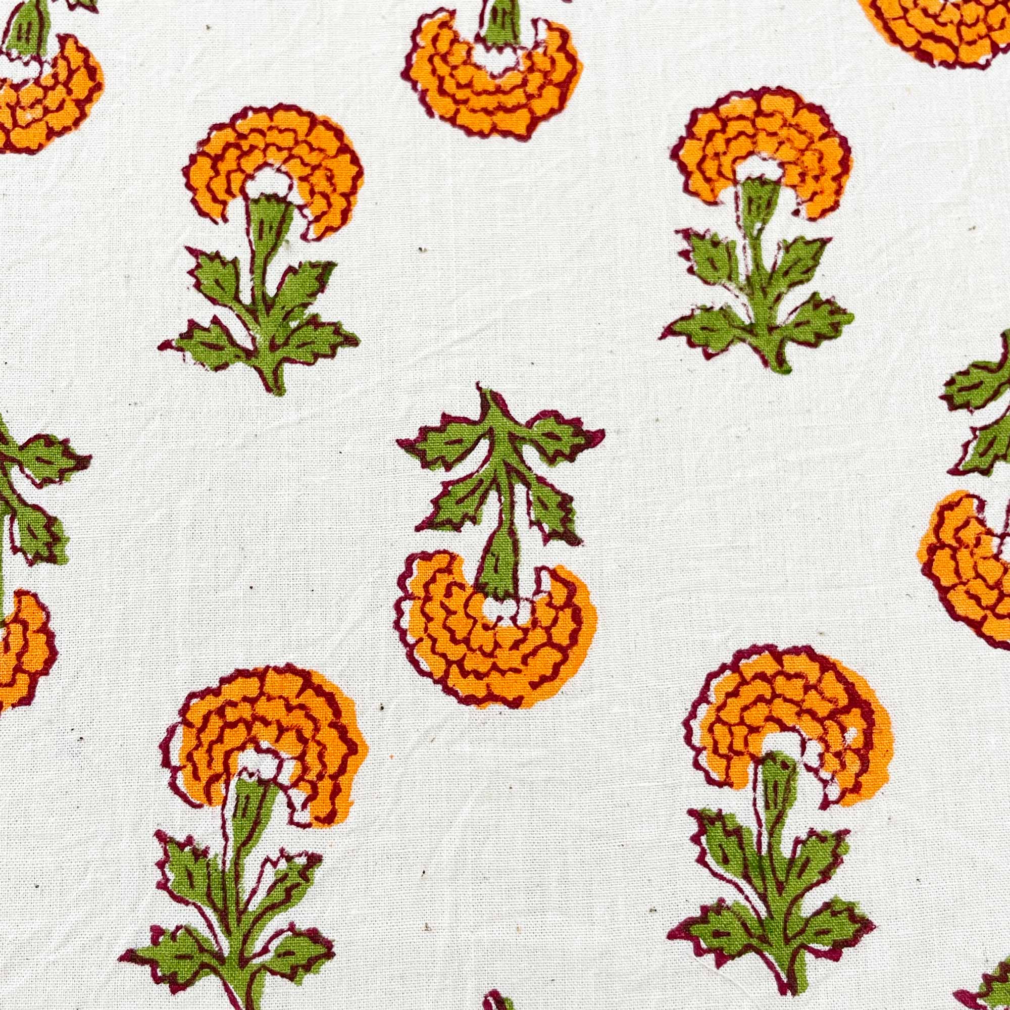 Close up look of hand block printed marigold flower organic fabric