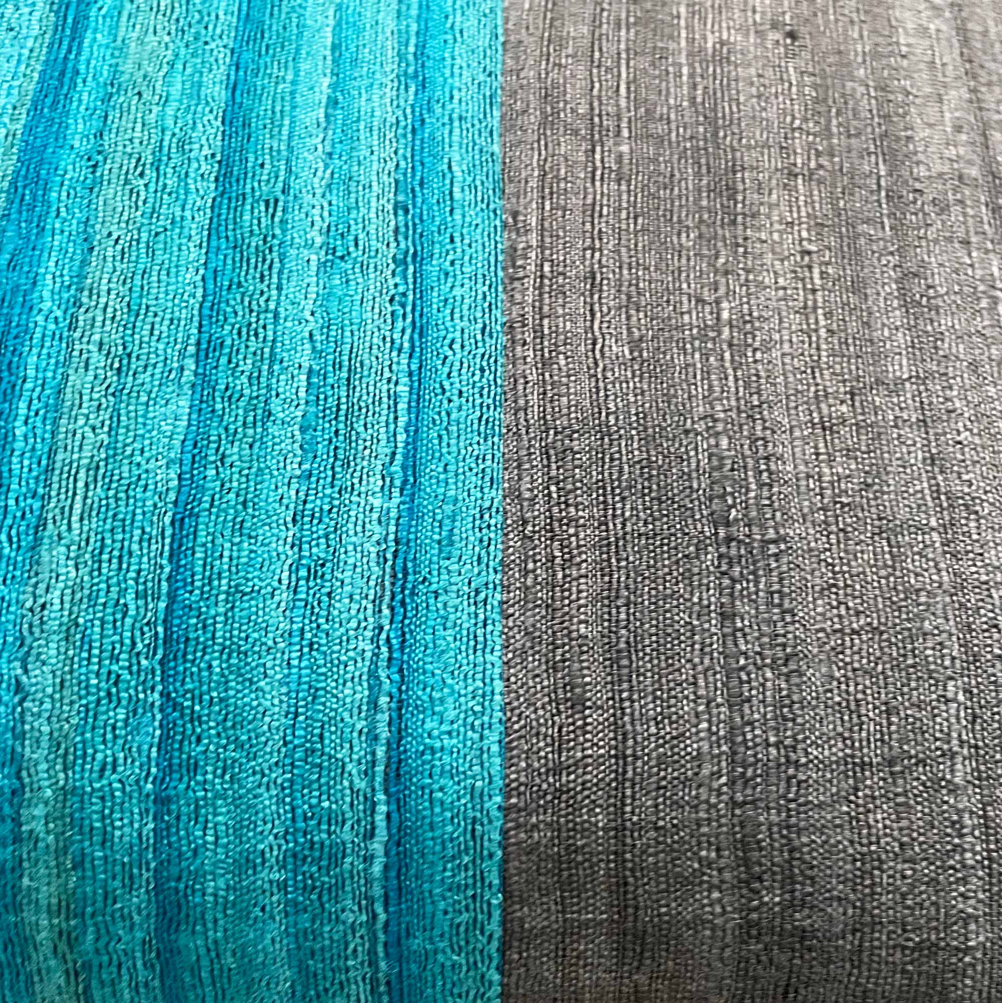 Styled grey and teal colorblock silk pillow cover suited for modern and minimalist interiors.