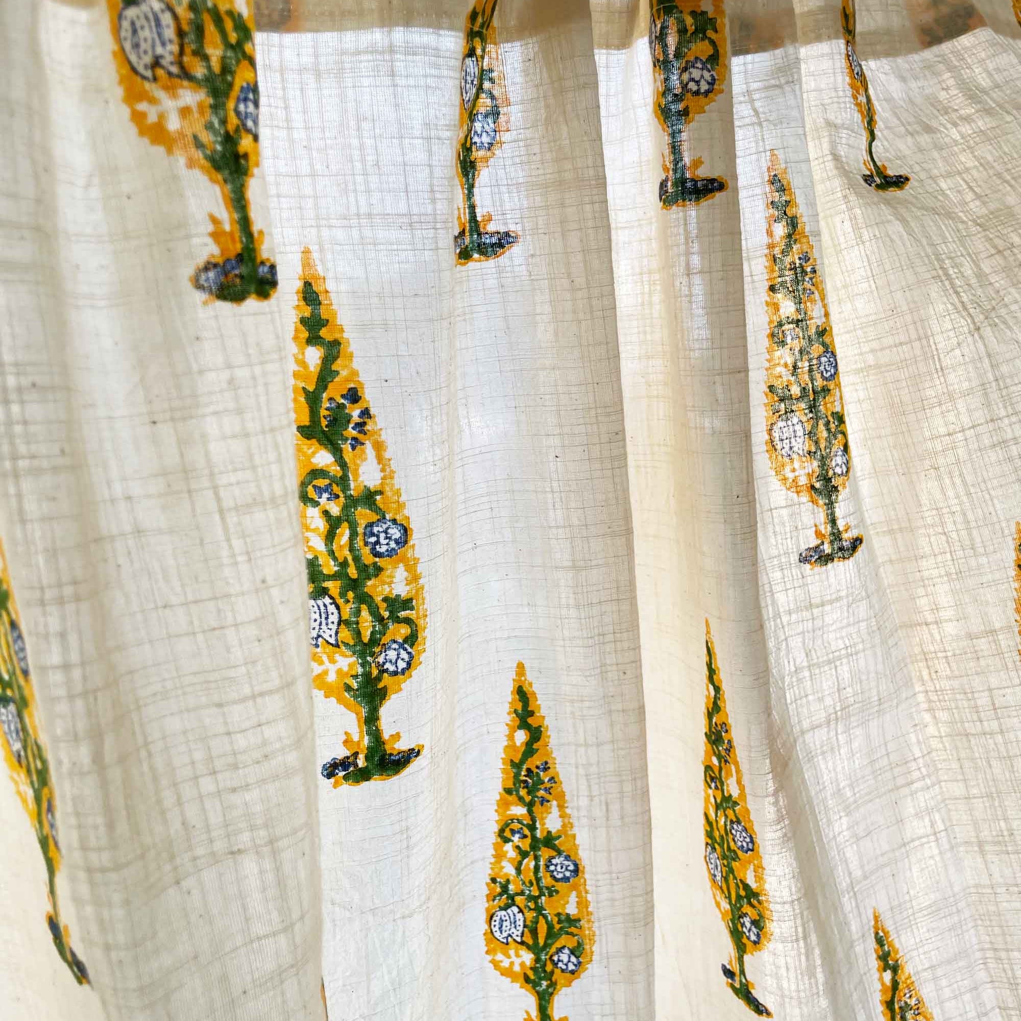 White fabric with yellow and green tree patterns