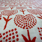 Textile with orange tulips floral patterns on a white background