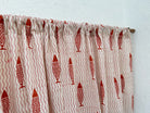 Textile with red fish pattern on a white background