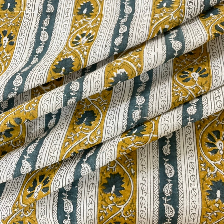Patterned fabric with yellow, blue, and white design