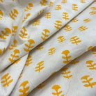 White fabric with yellow floral patterns