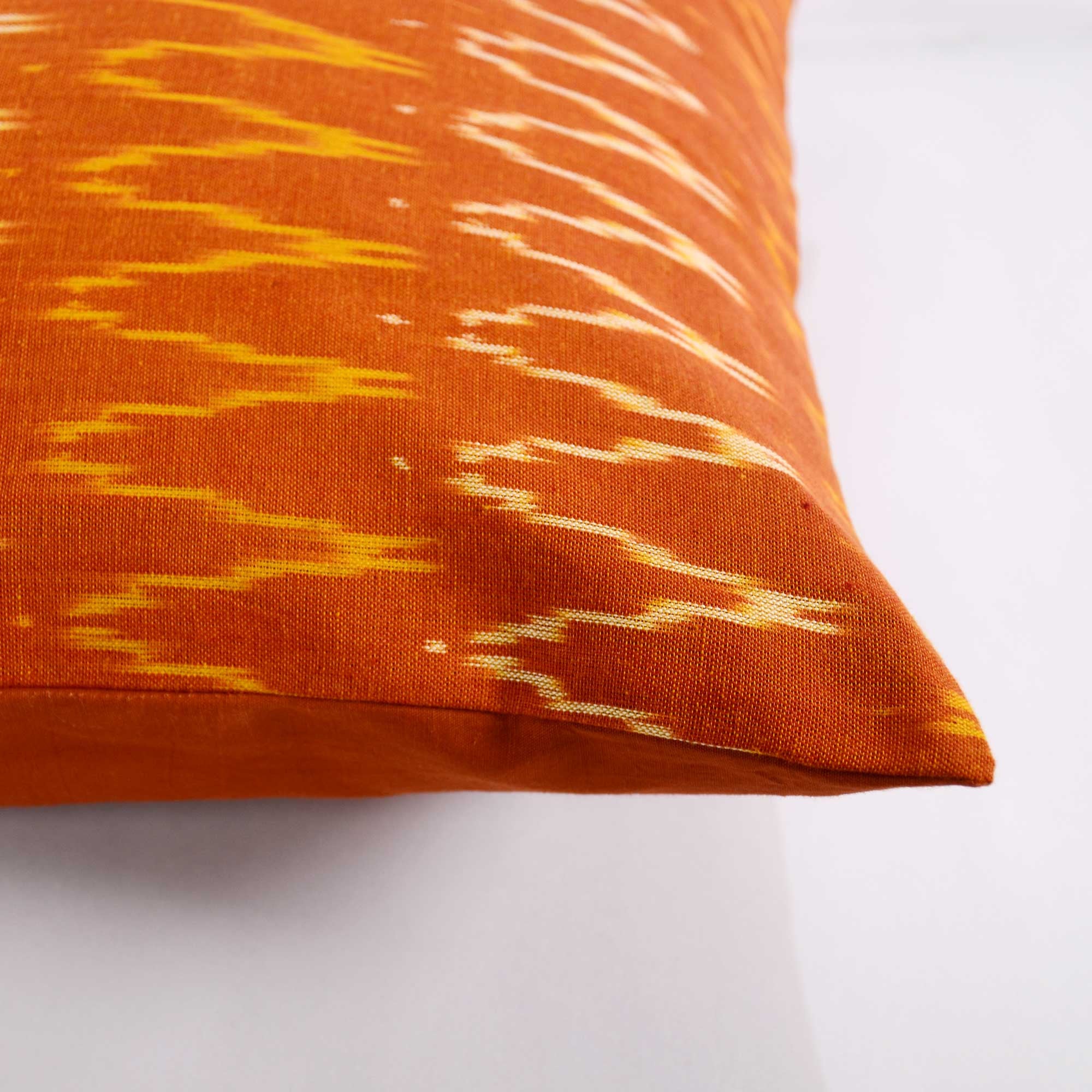 brown and mustard cotton ikat pillow